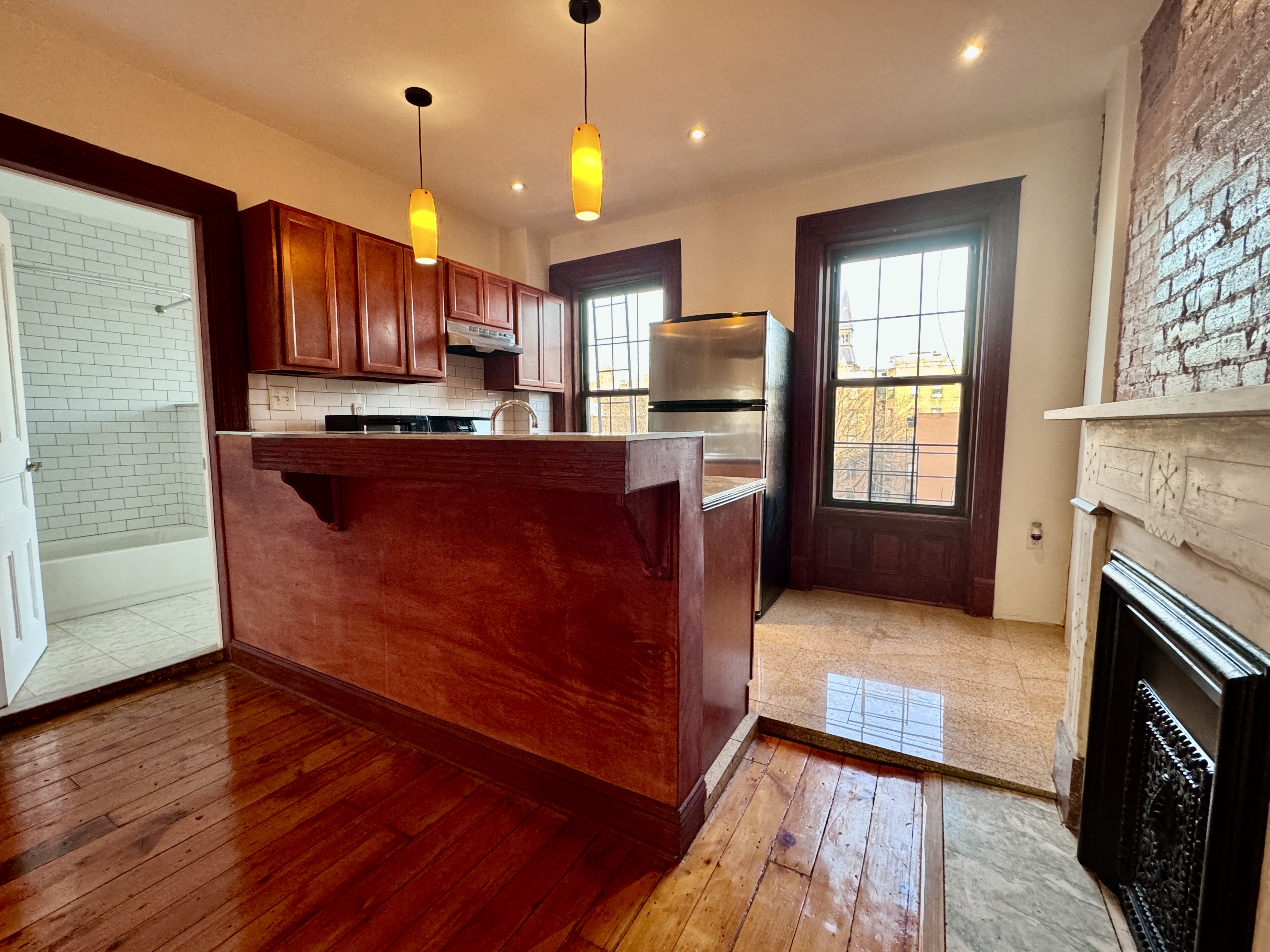 15 Arlington Place, Unit 3 Brooklyn, NY 11216 - Photo 12 of 14 a view of kitchen with sink and wooden floor