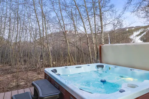 a backyard of a house with table and chairs