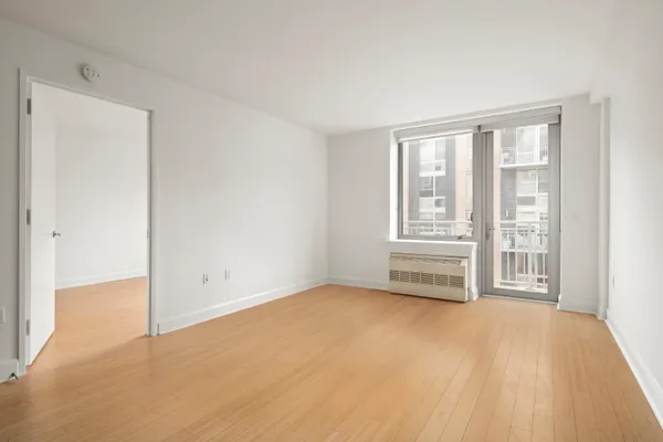 a view of an empty room with a window