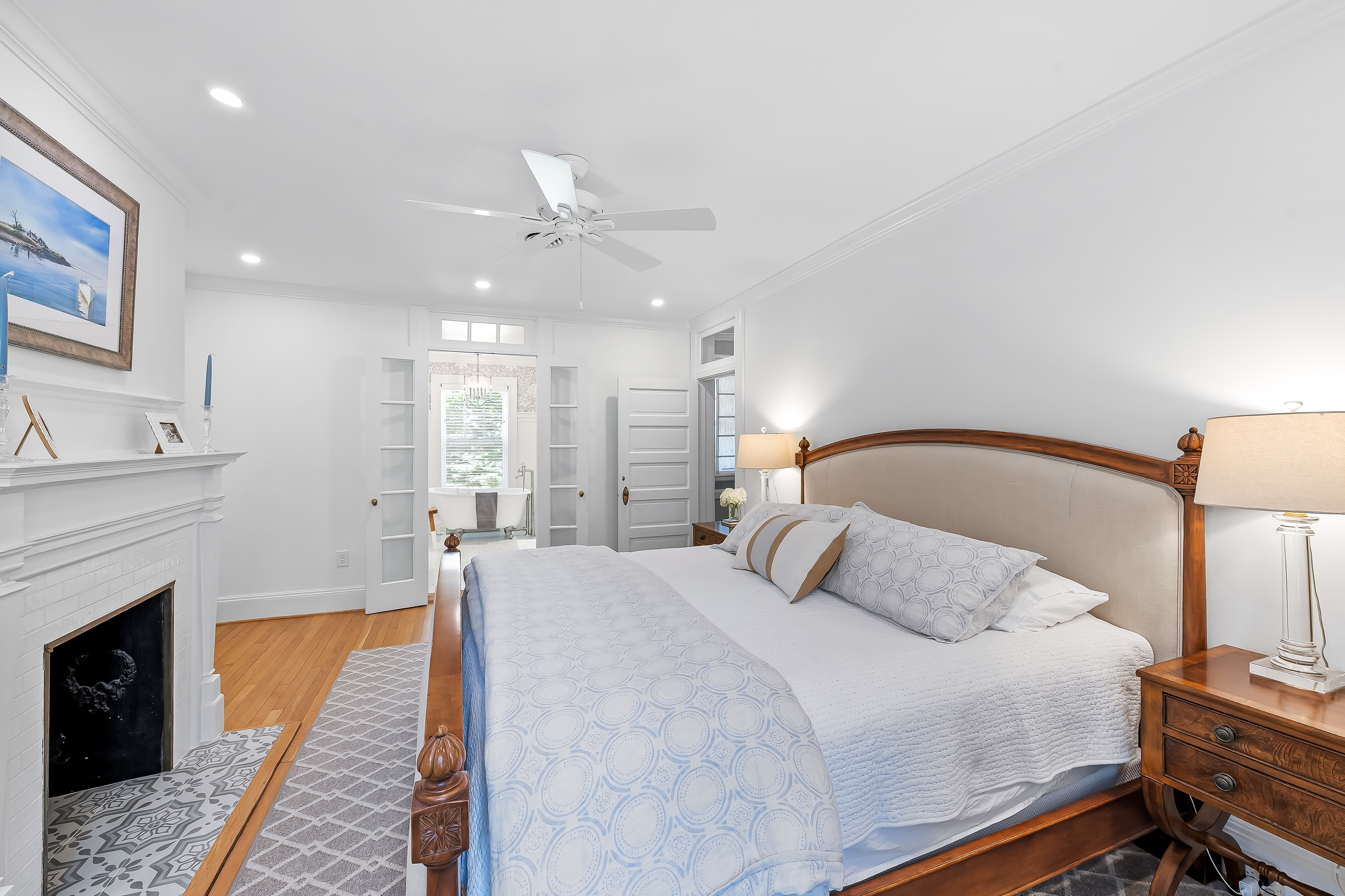 6 Elmhurst Road Baltimore, MD 21210 - Photo 61 of 100 a bedroom with a large bed and a fireplace