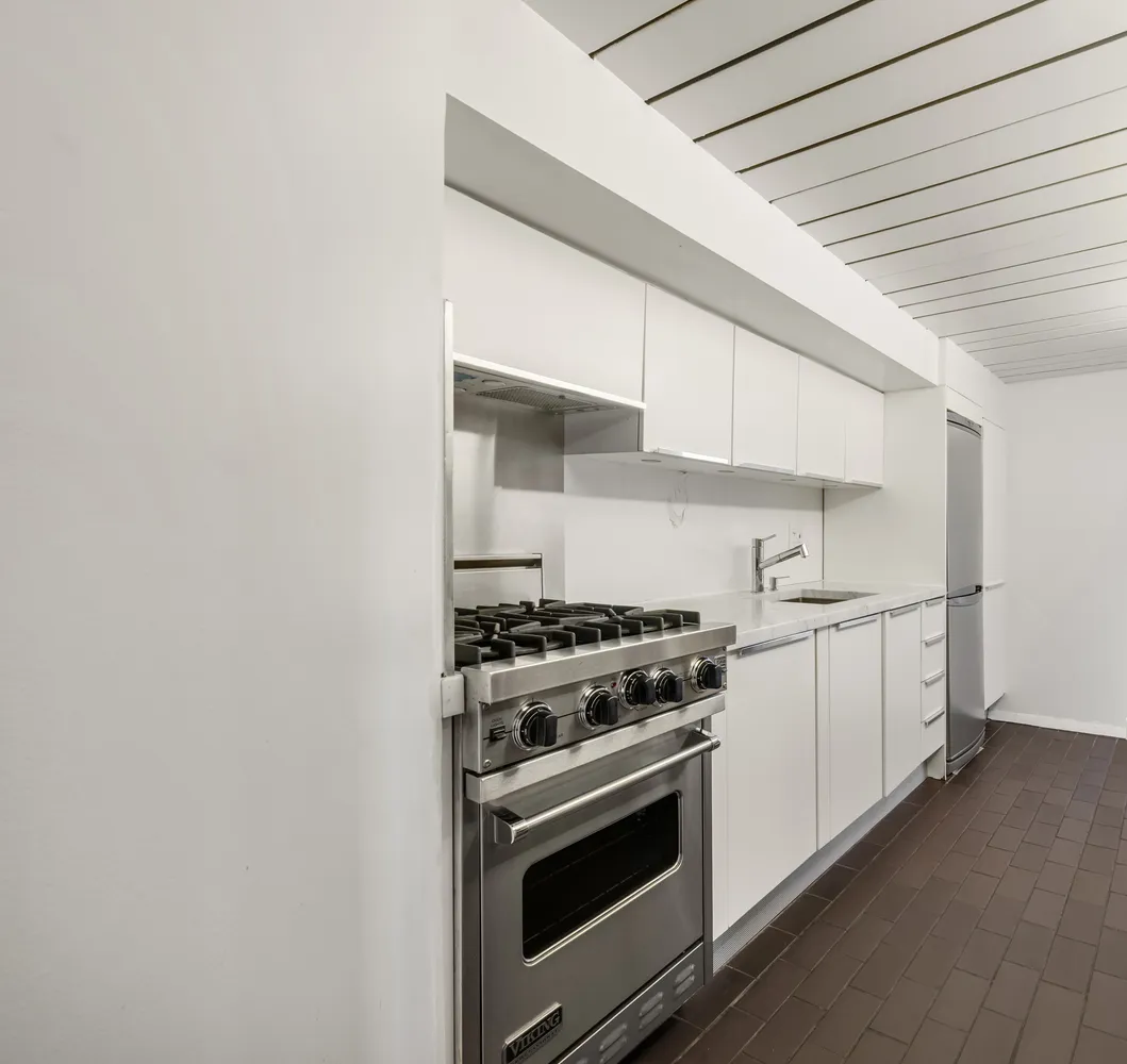 a kitchen with a stove and a microwave