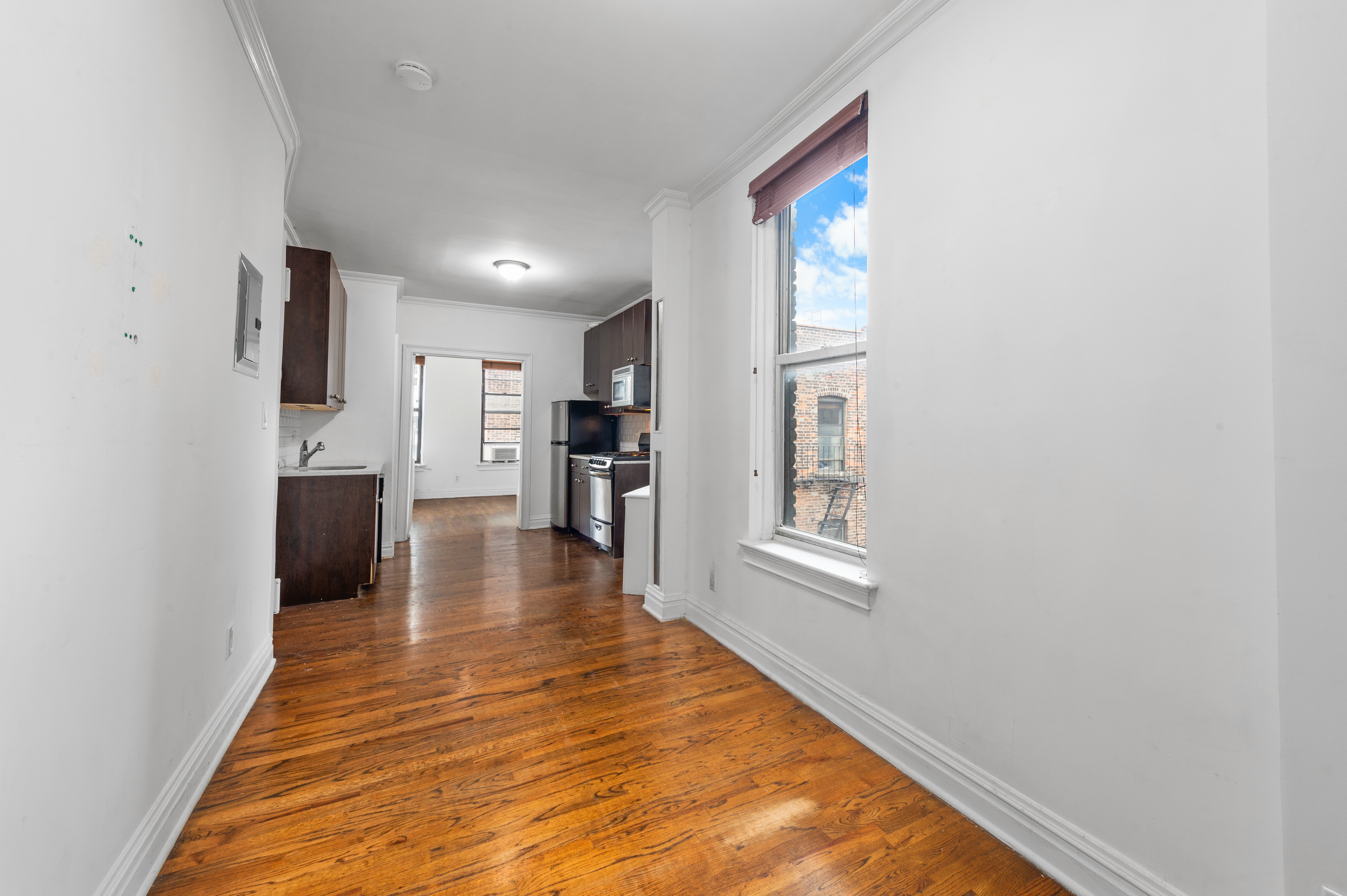 142 Sullivan Street, Unit 21 Manhattan, NY 10012 - Photo 2 of 8 a view of a living room with windows