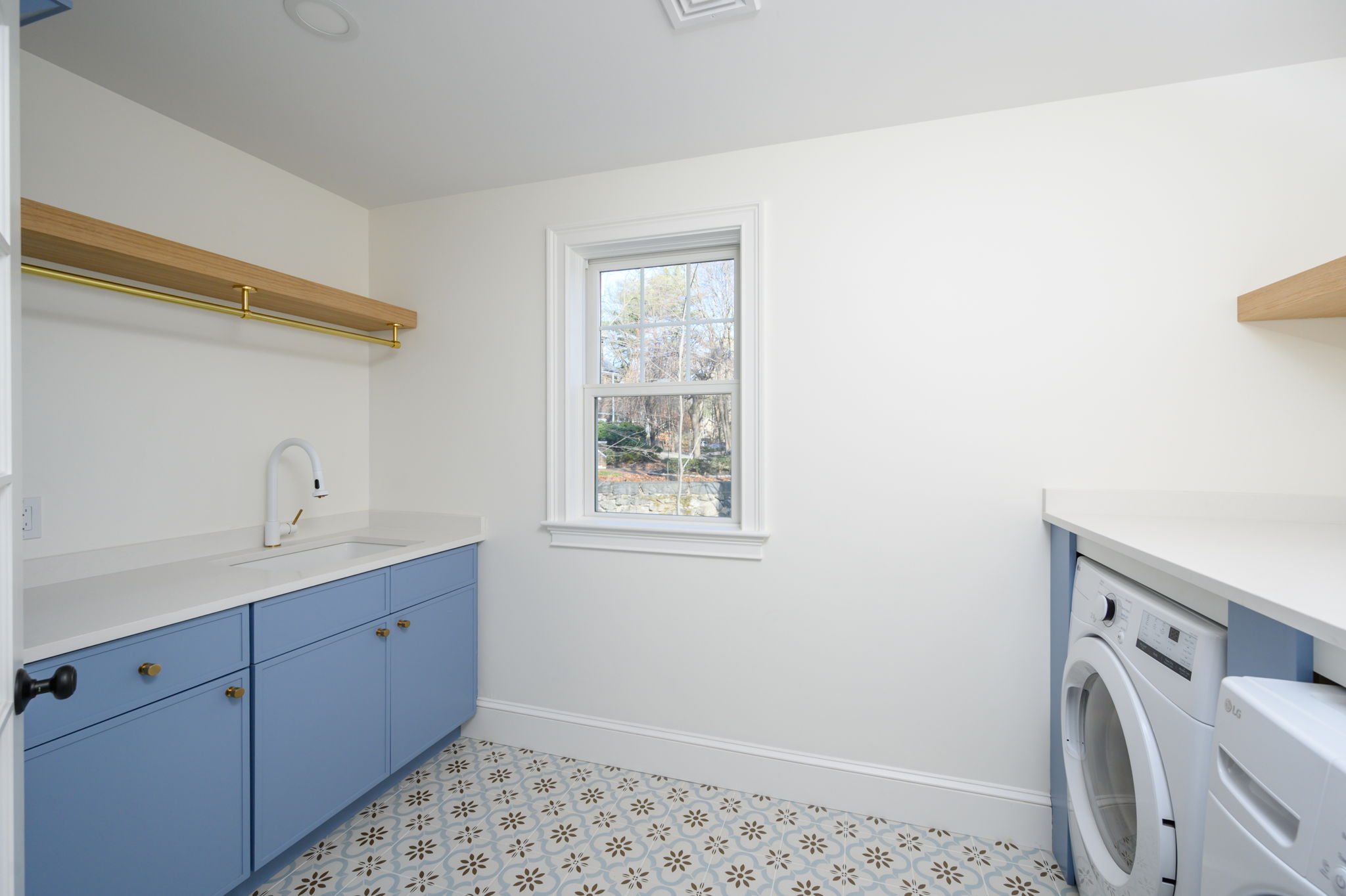 249 Central Avenue Milton, MA 02186 - Photo 40 of 61 a utility room with cabinets washer and dryer