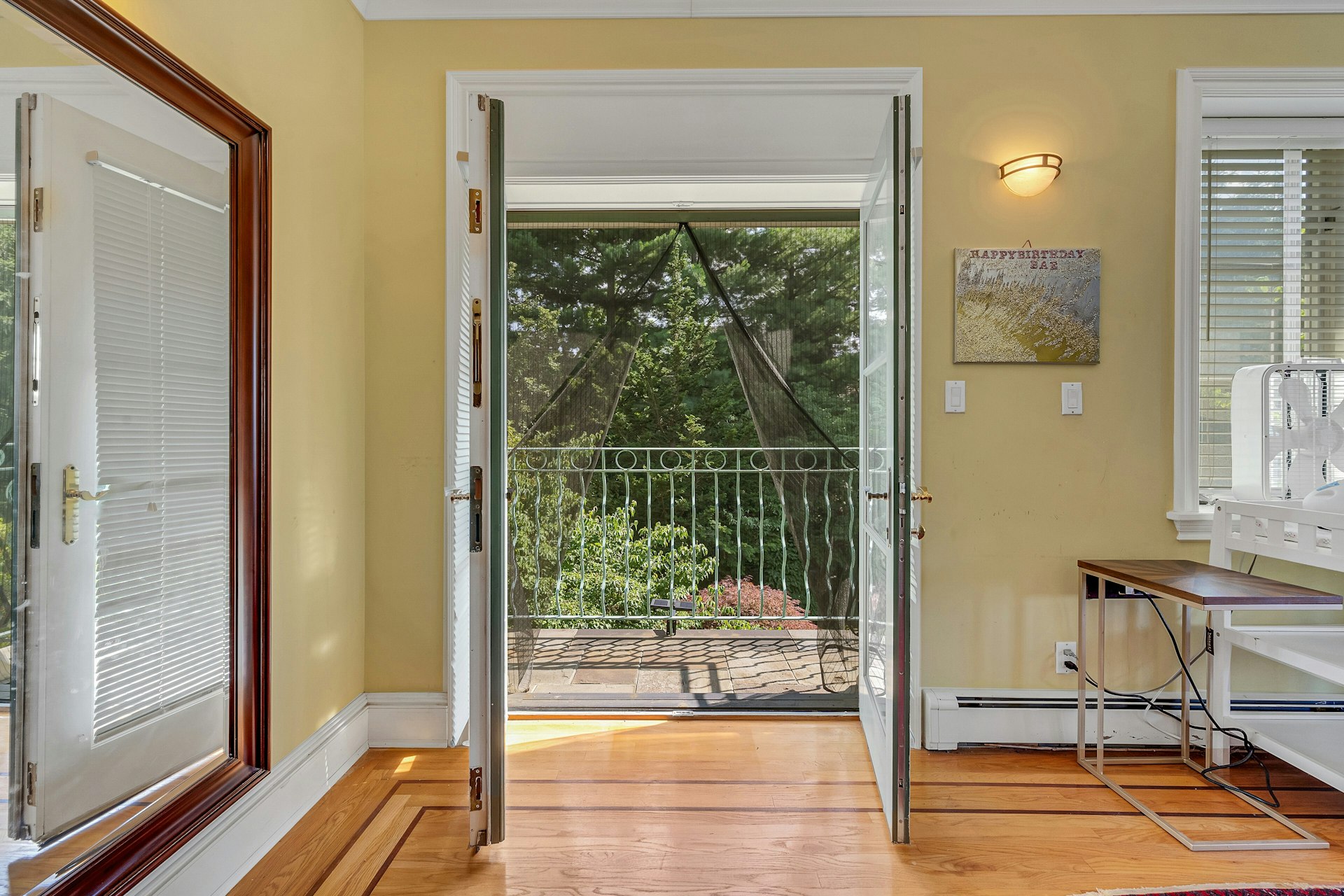 5440 Independence Avenue Bronx, NY 10471 - Photo 22 of 36 a view of a room with wooden floor and windows