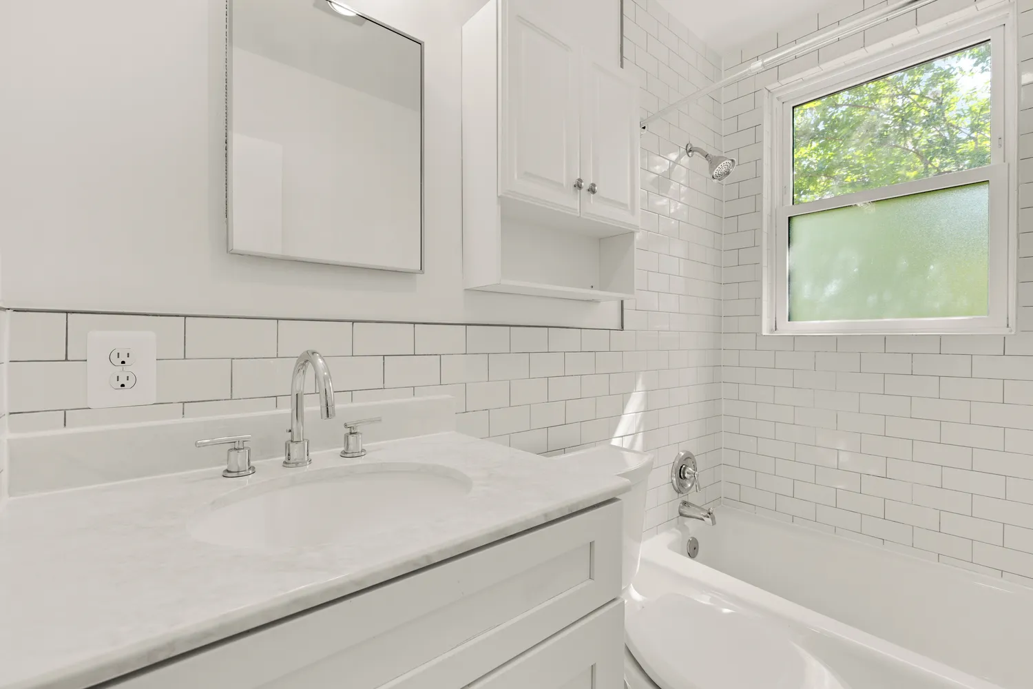 a bathroom with a sink and a bathtub