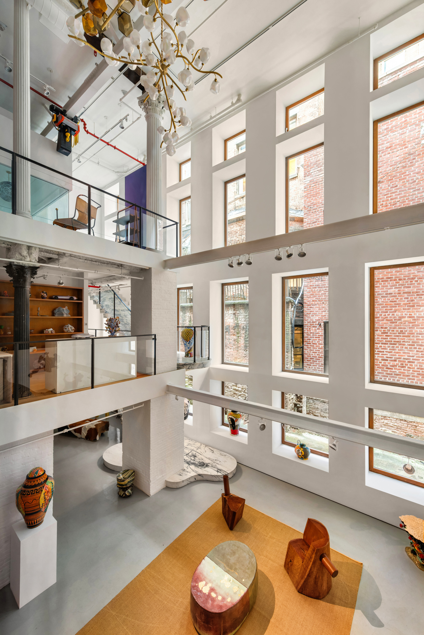 64 White Street, Unit RETAIL Manhattan, NY 10013 - Photo 14 of 21 a living room filled with furniture and a chandelier