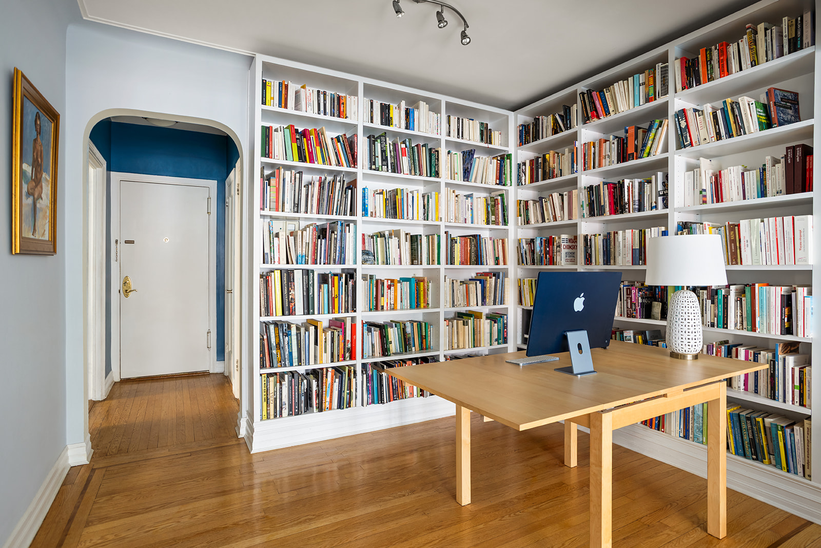 35-24 78th Street, Unit B51 Queens, NY 11372 - Photo 7 of 11 a view of a workspace with bookshelf