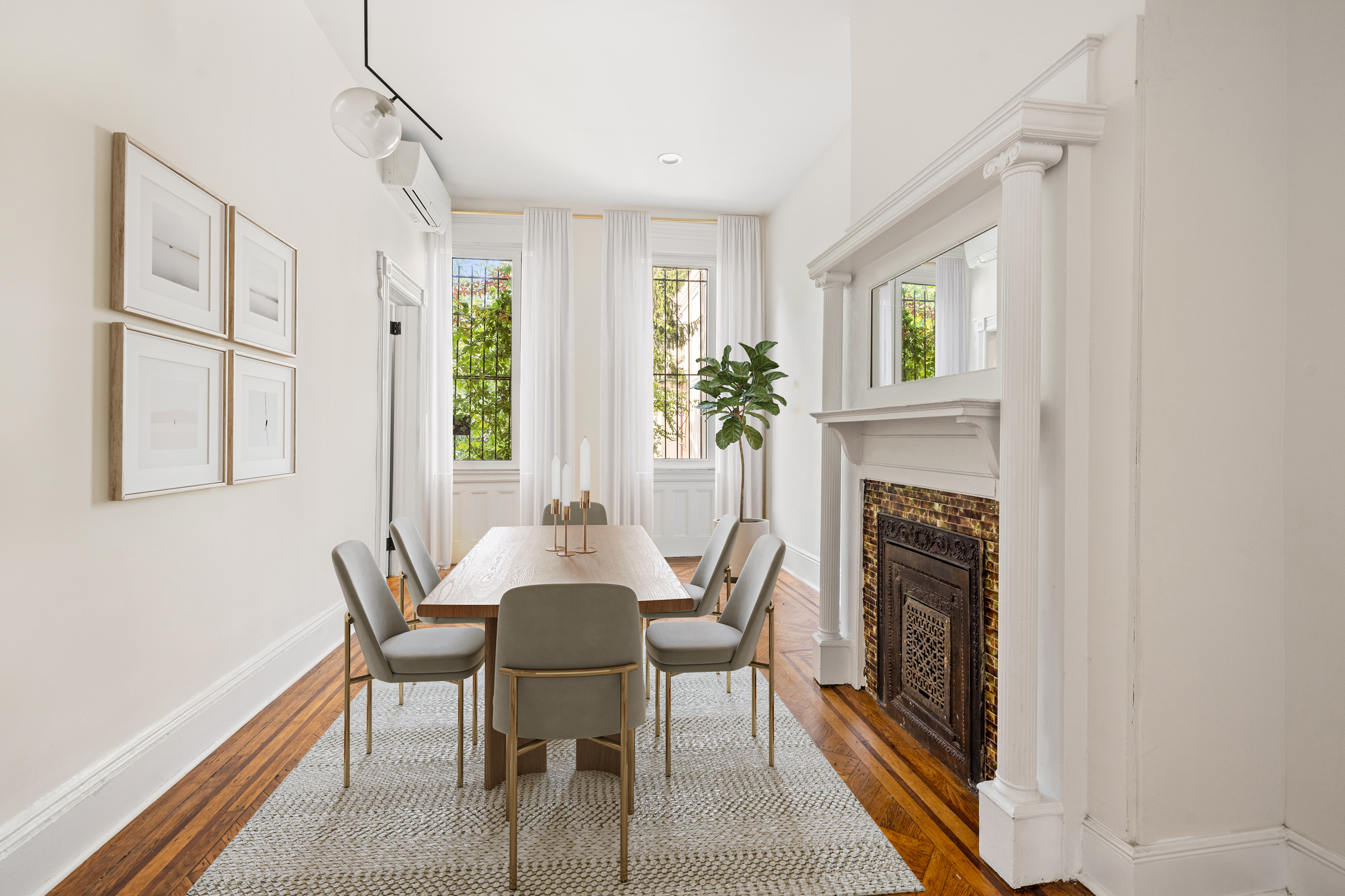 285 Weirfield Street Brooklyn, NY 11221 - Photo 6 of 16 a dining room with furniture a fireplace and wooden floor