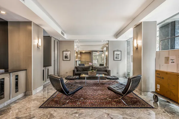 a living room with furniture and a rug