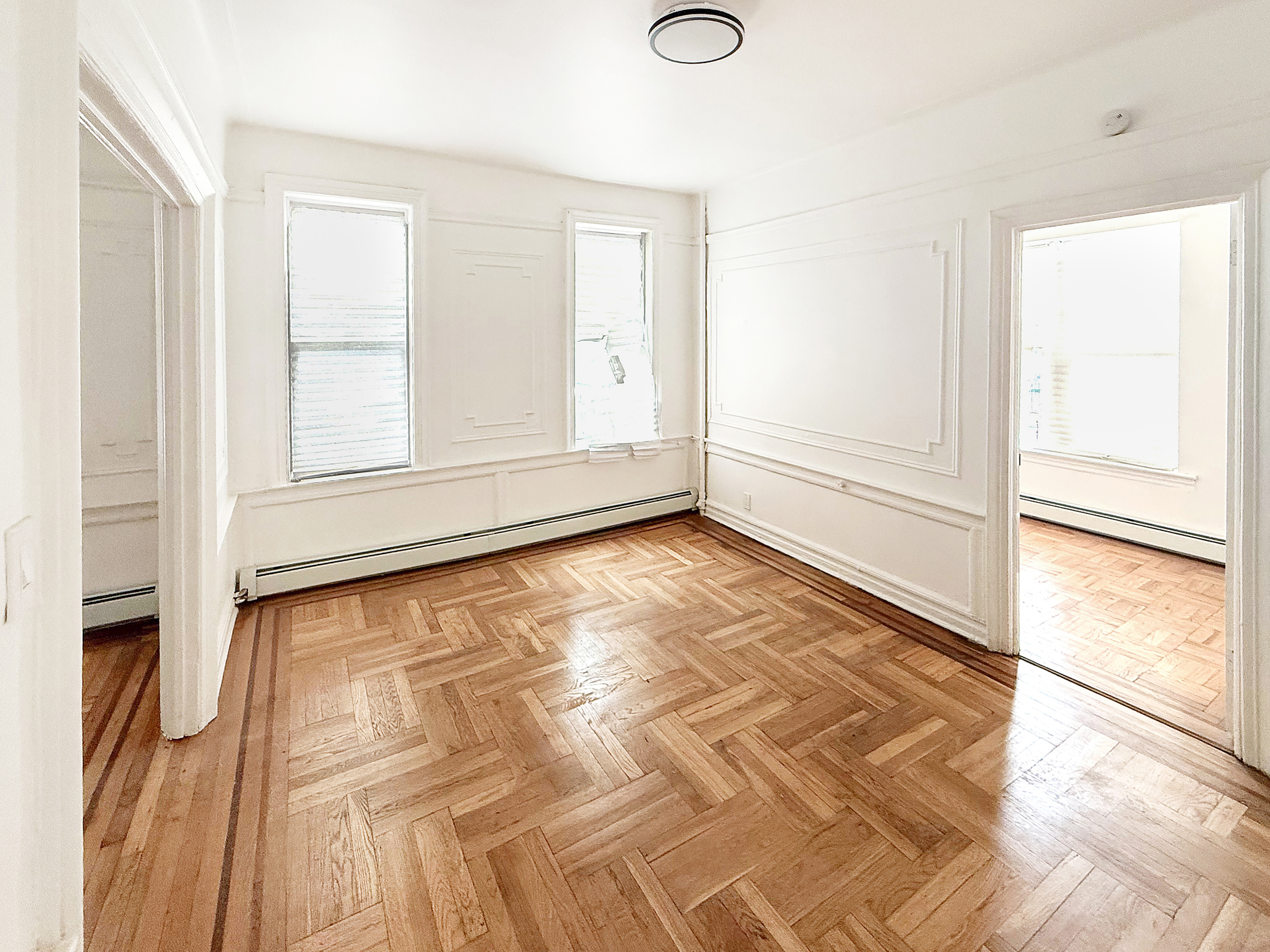 319 East 49th Street, Unit 1 Brooklyn, NY 11203 - Photo 4 of 8 a view of an empty room and window