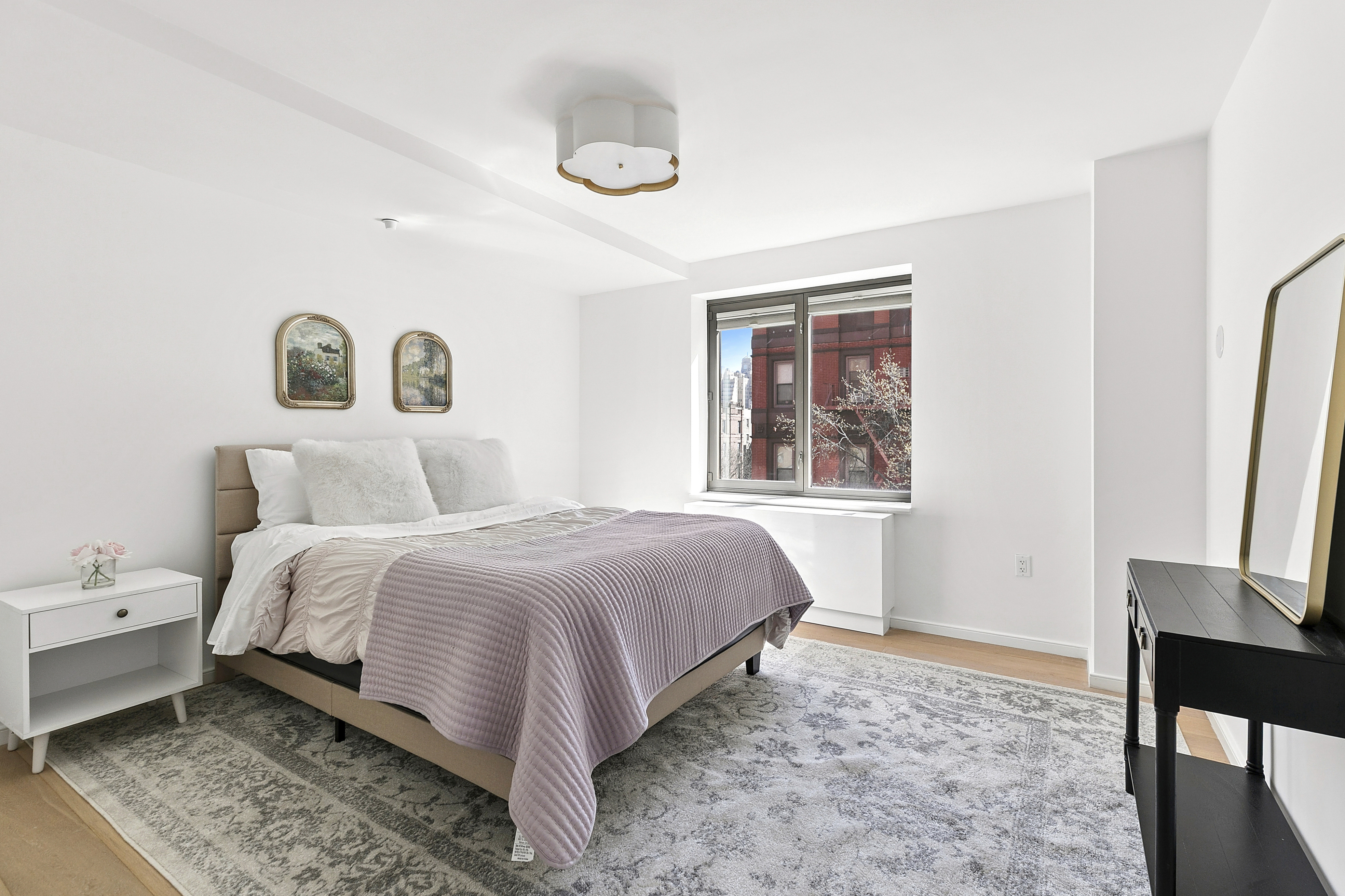 101 West 87th Street, Unit 505 Manhattan, NY 10024 - Photo 9 of 15 a bedroom with a bed and a window