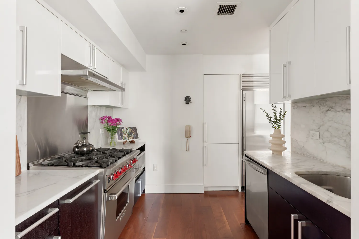a kitchen that has a lot of fruit on it and wooden floor