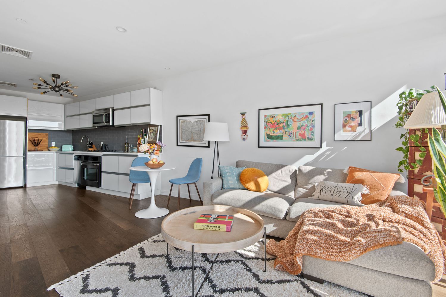 179 Woodpoint Road, Unit 4A Brooklyn, NY 11211 - Photo 2 of 16 a living room with furniture and kitchen view