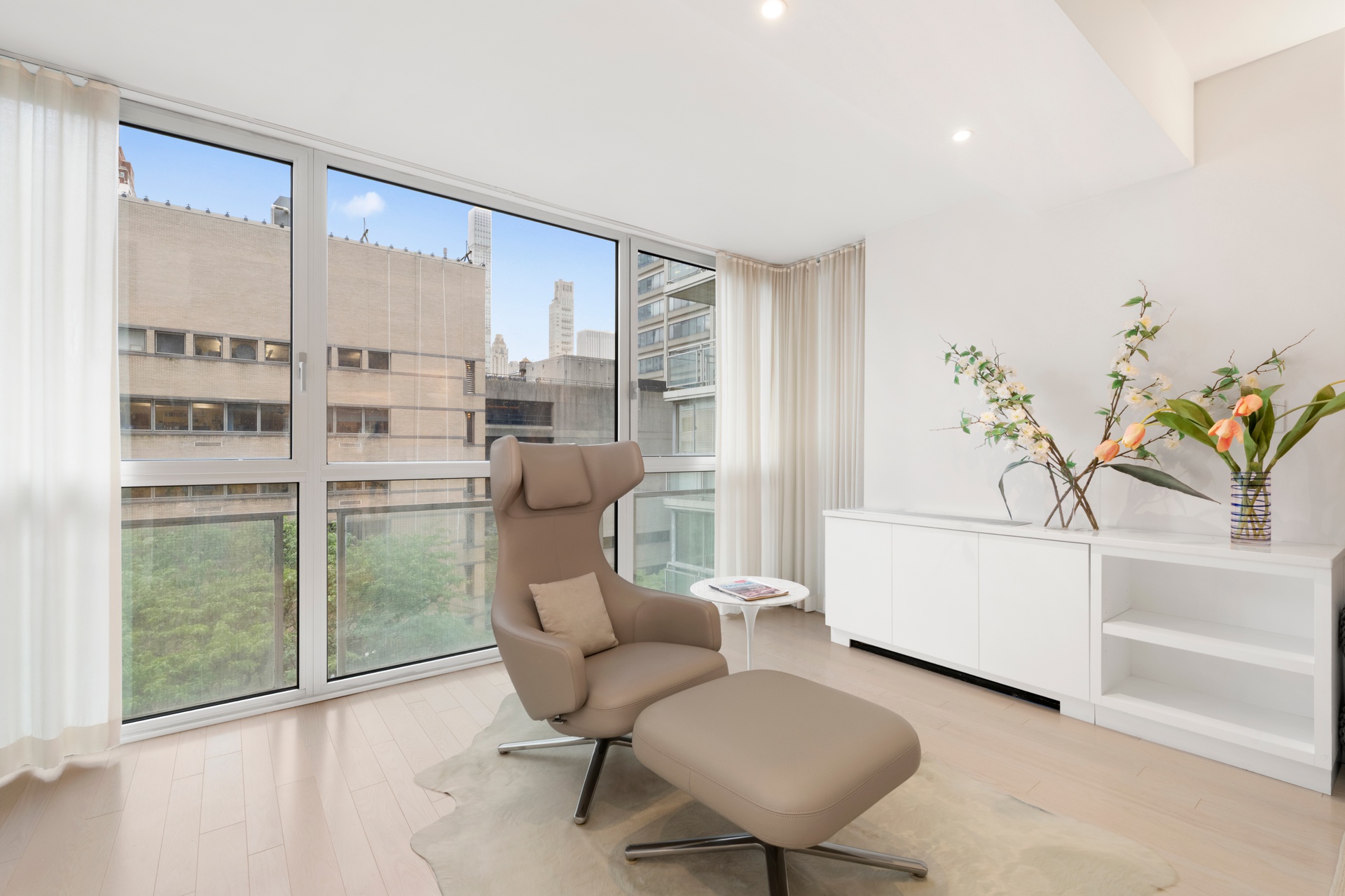 150 East 69th Street, Unit 7K Manhattan, NY 10021 - Photo 11 of 22 a living room with furniture and a gate