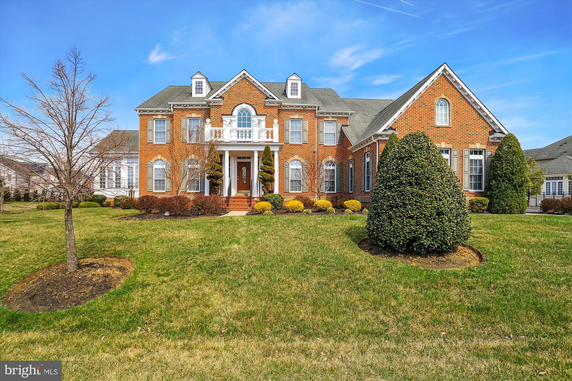 14302 Derby Ridge Road Bowie, MD 20721 - Photo 5 of 67 a front view of a house with a yard