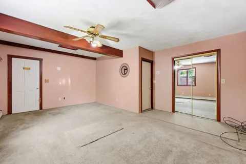 a view of a livingroom with an empty room