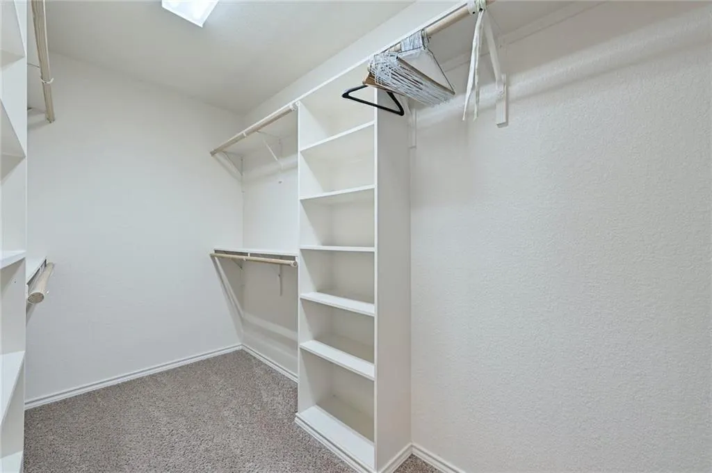 a view of an empty walk in closet