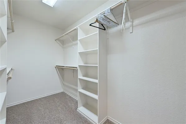 a view of an empty walk in closet