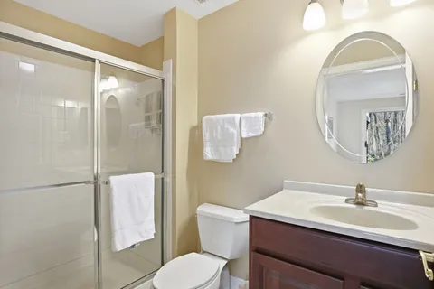 a view of a park with iron fence