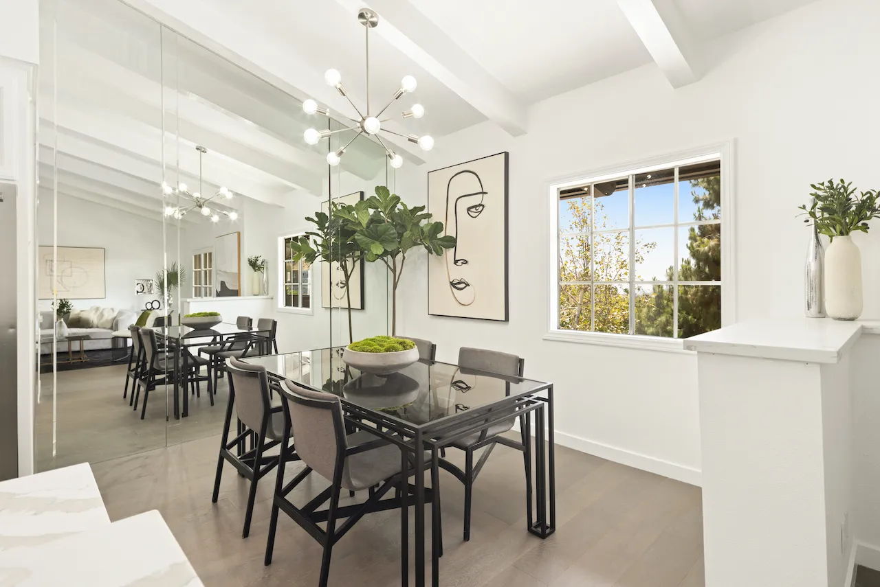 a view of a dining room with furniture and a chandelier