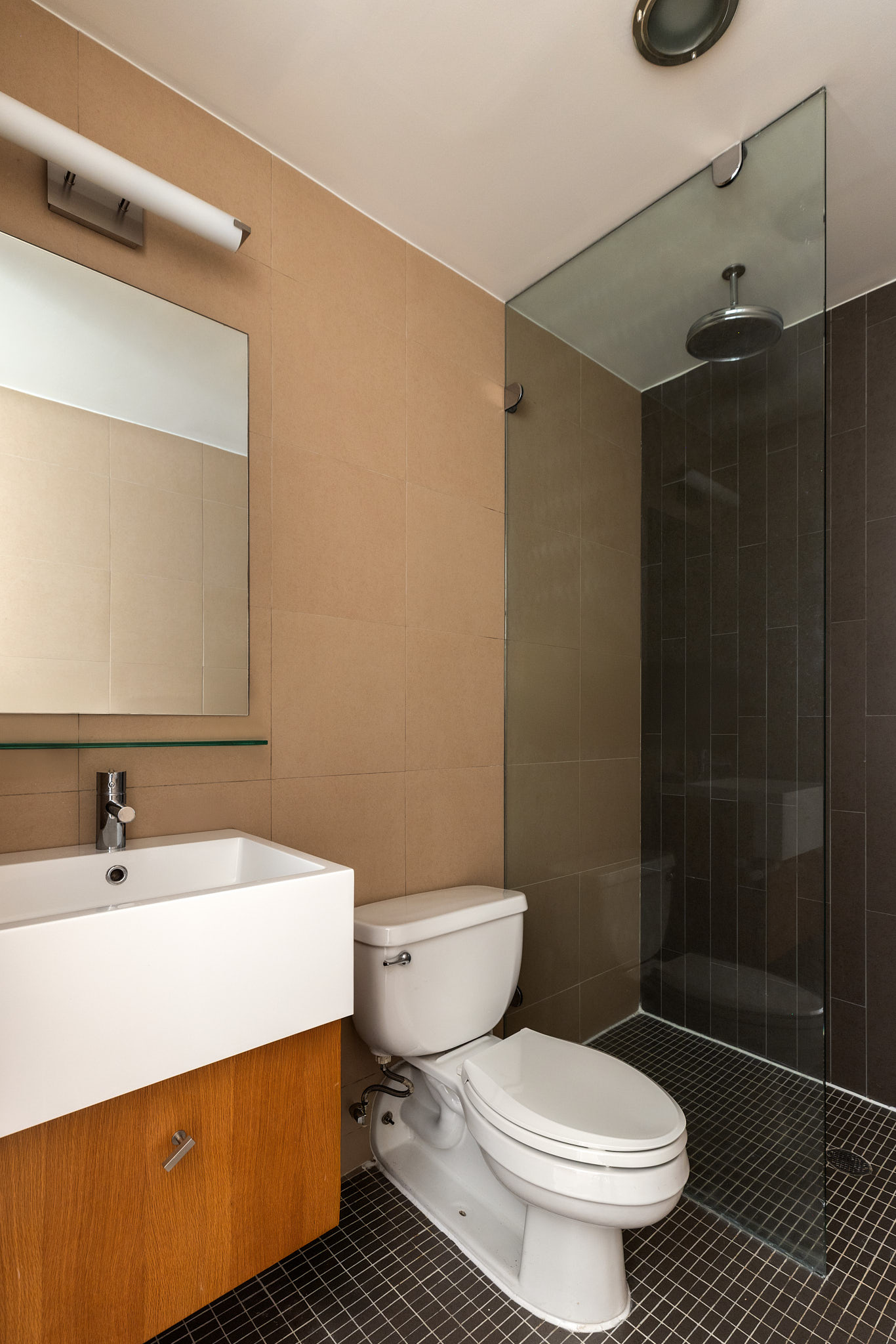 124 West 24th Street, Unit 4A Manhattan, NY 10011 - Photo 9 of 13 a bathroom with a sink toilet and shower