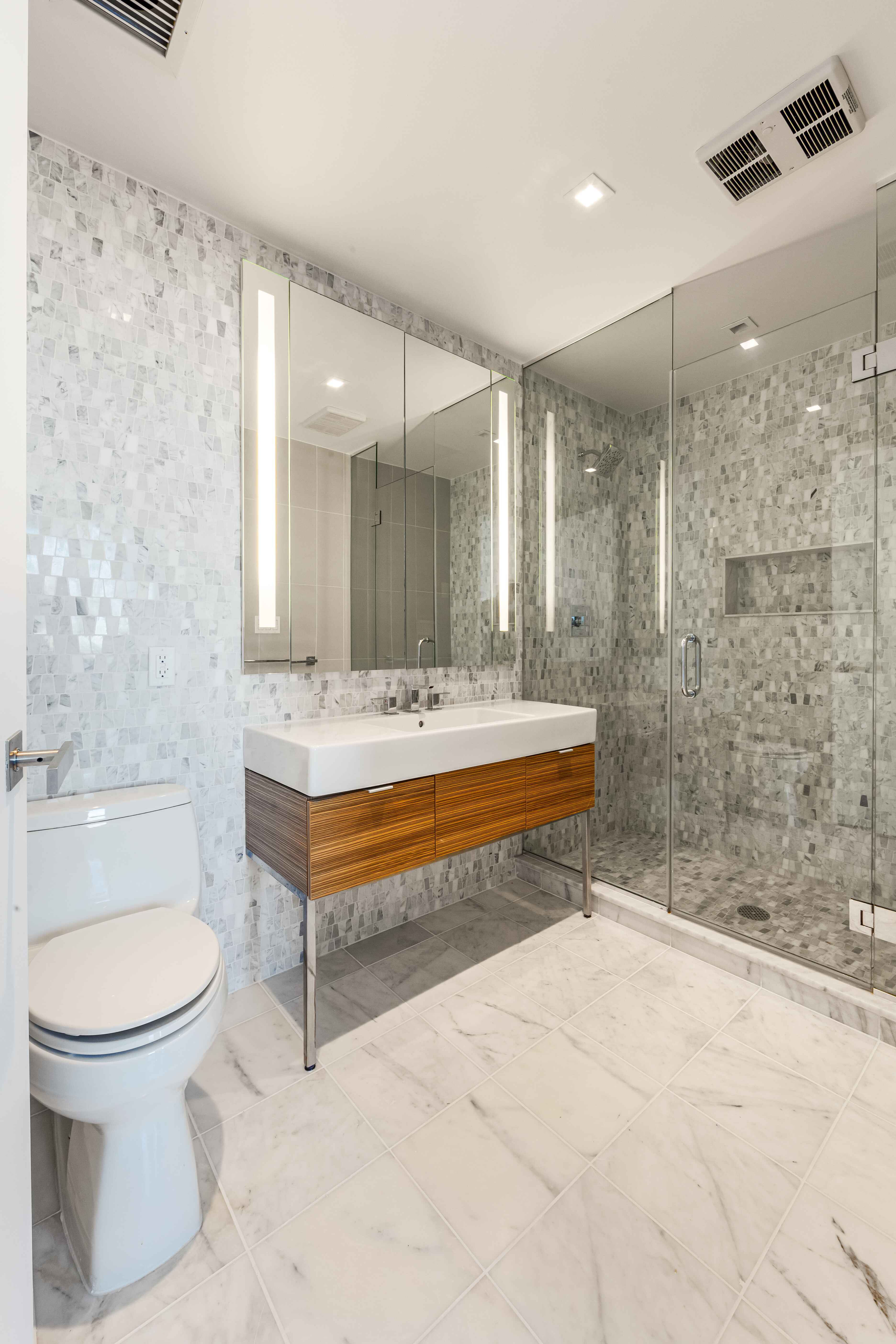 202 8th Street, Unit 8A Brooklyn, NY 11215 - Photo 13 of 21 a bathroom with a sink a toilet and shower