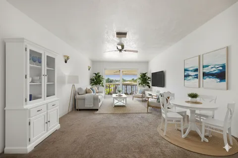 an aerial view of a house with a garden and lake view