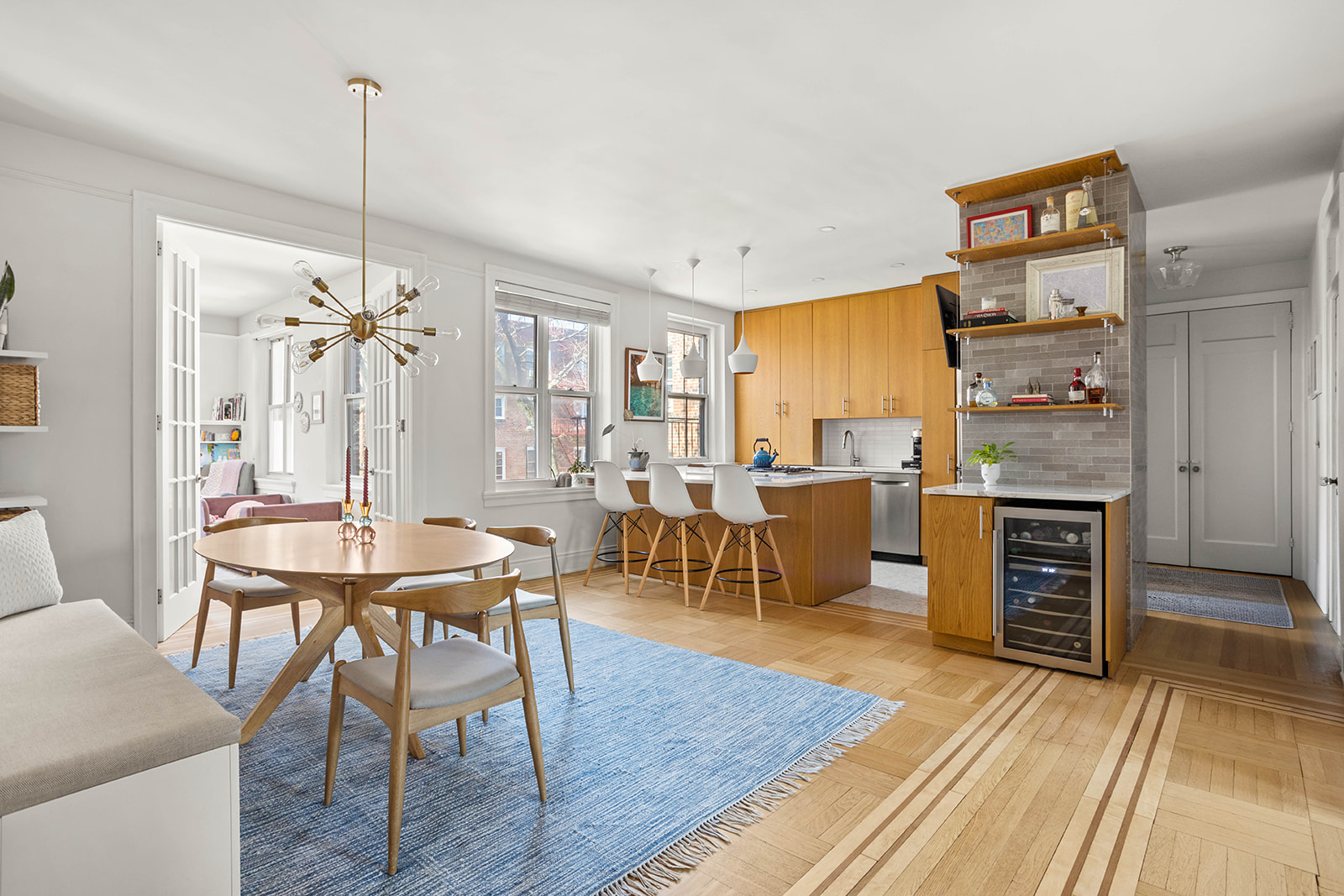 34-28 80th Street, Unit 41 Queens, NY 11372 - Photo 1 of 15 a dining room with furniture and wooden floor