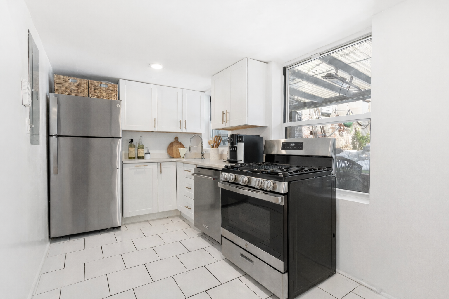 279 Cumberland Street, Unit 1 Brooklyn, NY 11238 - Photo 2 of 7 a kitchen with appliances a sink and cabinets