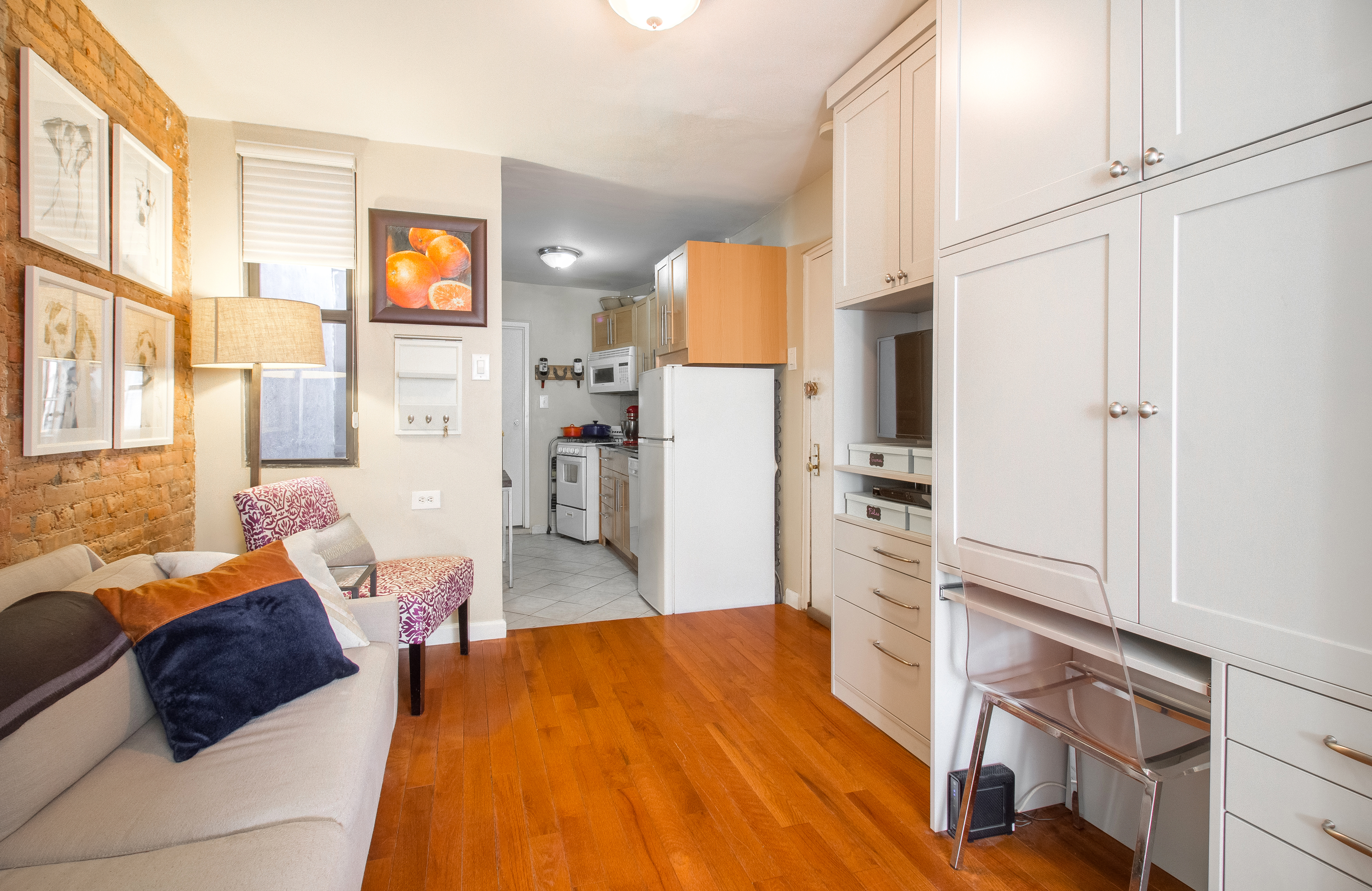246 East 90th Street, Unit 5C Manhattan, NY 10128 - Photo 2 of 13 a bedroom with a bed dresser and a window