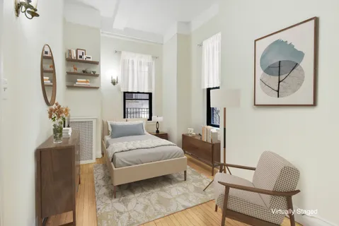 a bedroom with a bed and furniture