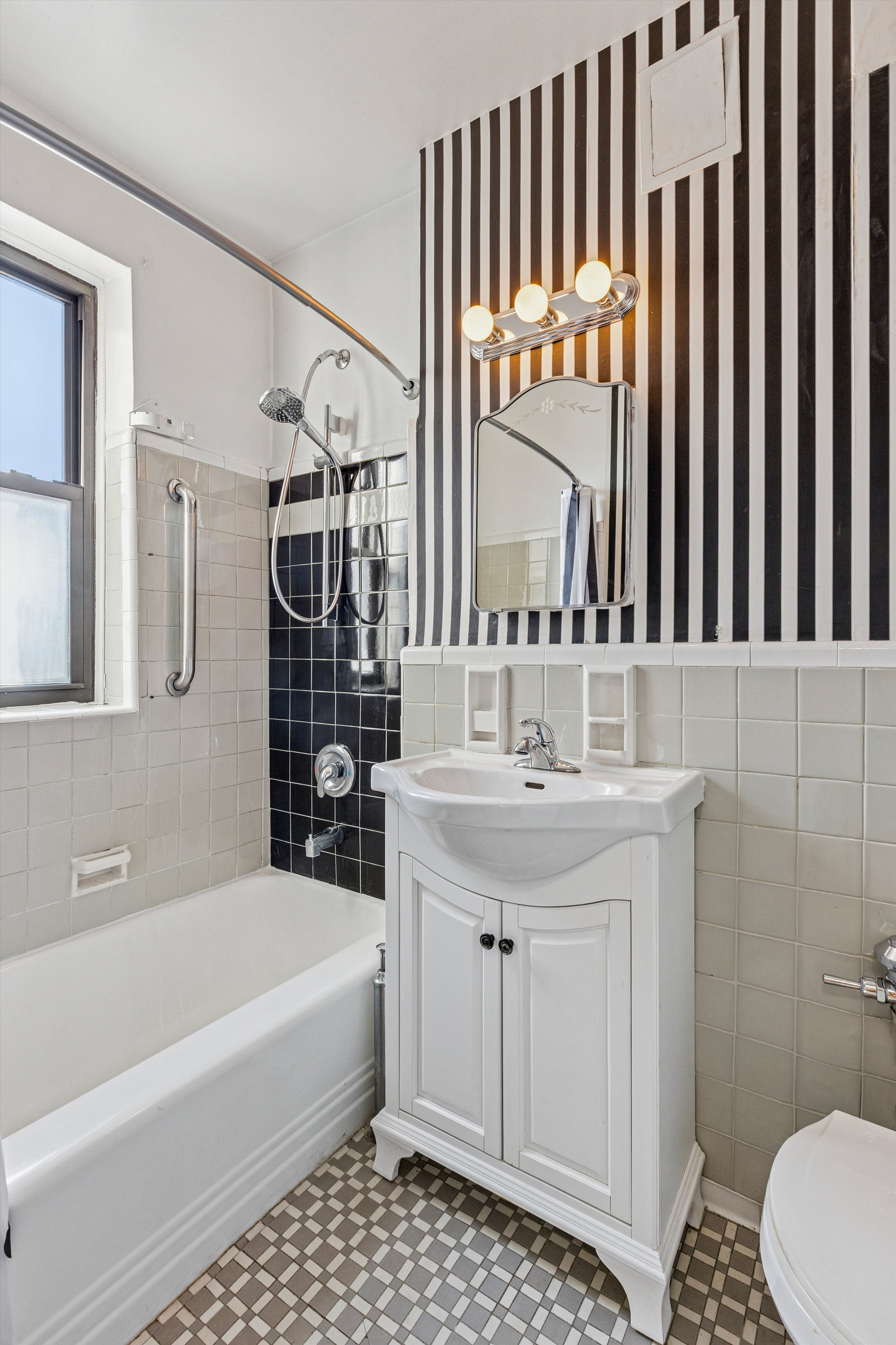 90 Park Terrace East, Unit 7C Manhattan, NY 10034 - Photo 11 of 21 a bathroom with a sink a toilet and shower