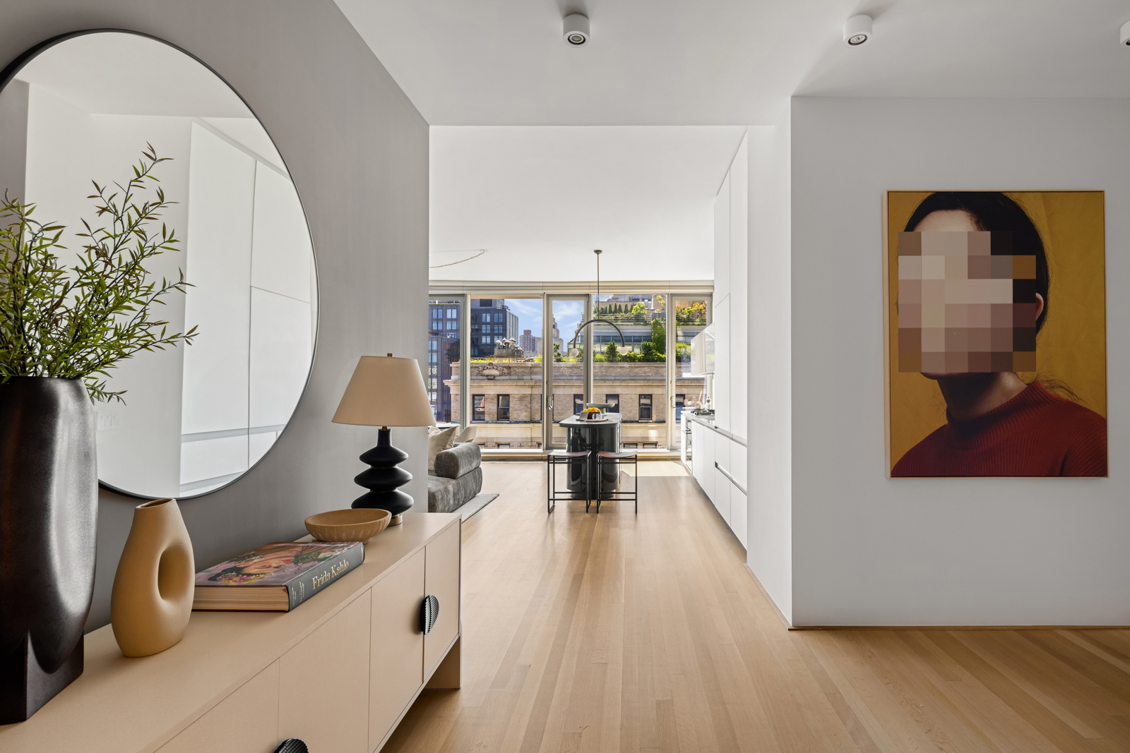 56 Leonard Street, Unit 14BEAST Manhattan, NY 10013 - Photo 4 of 35 a living room with furniture and a wooden floor