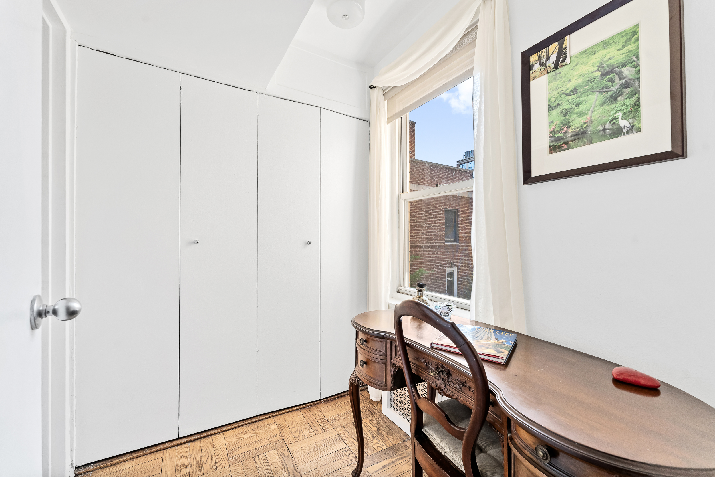 310 Lexington Avenue, Unit 15A Manhattan, NY 10016 - Photo 10 of 17 a view of a room with furniture and wooden floor