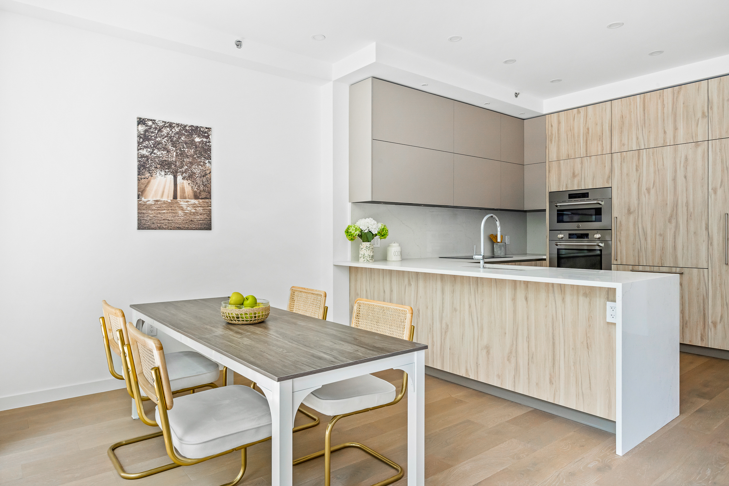 249 18th Street, Unit 3 Brooklyn, NY 11215 - Photo 2 of 14 a kitchen with a table chairs and a refrigerator