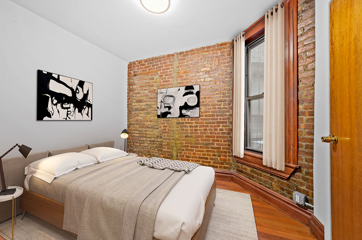 112 East 97th Street, Unit 4W Manhattan, NY 10029 - Photo 3 of 5 a bedroom with a bed and a painting on the wall