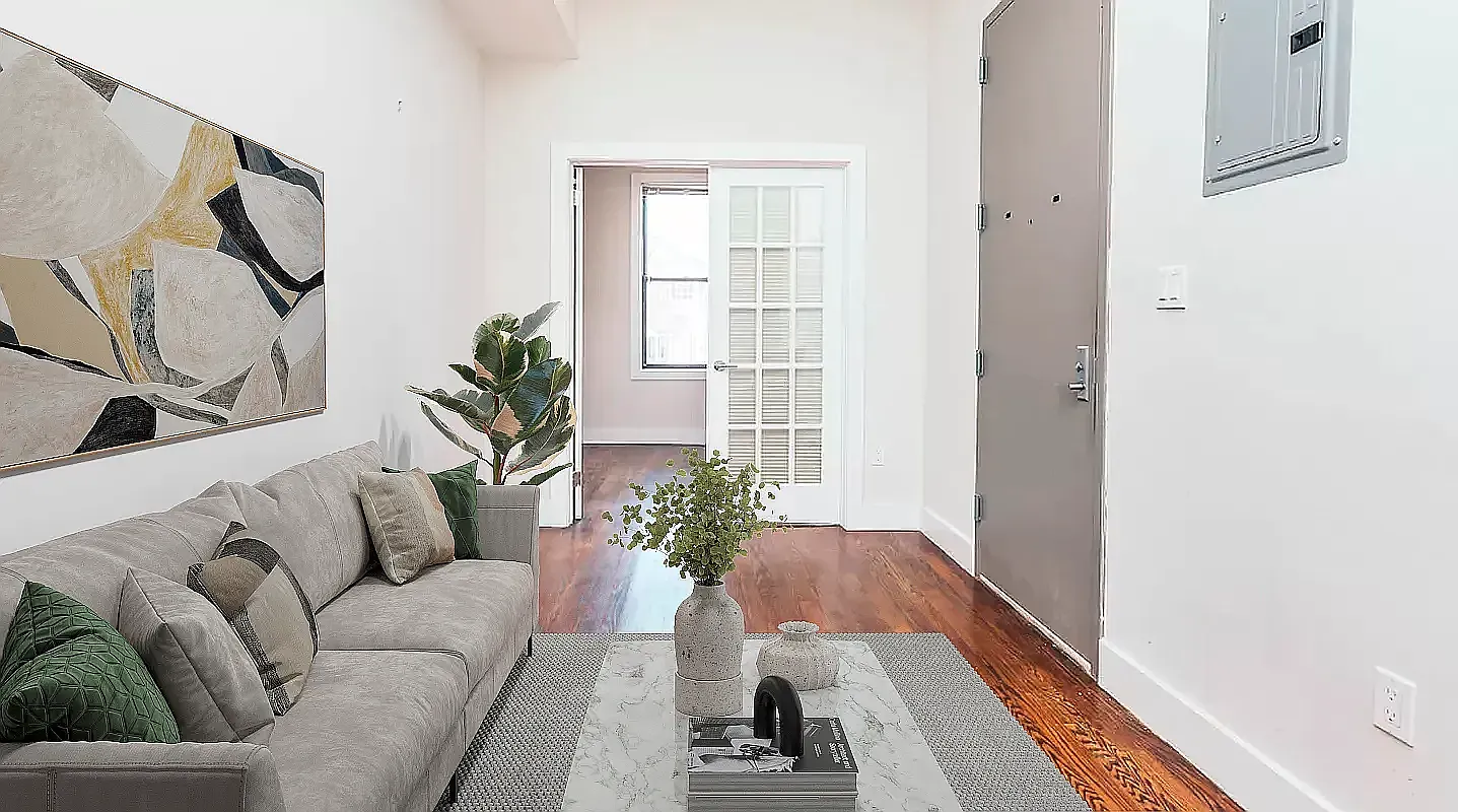 285 Cornelia Street, Unit 2R Brooklyn, NY 11221 - Photo 2 of 11 a living room with furniture and a potted plant