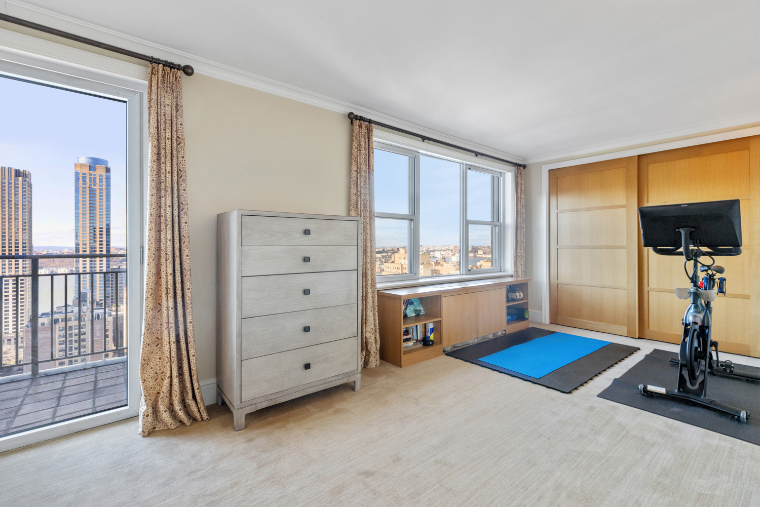 201 West 70th Street, Unit 29KL Manhattan, NY 10023 - Photo 9 of 20 a kitchen with white cabinets and white appliances