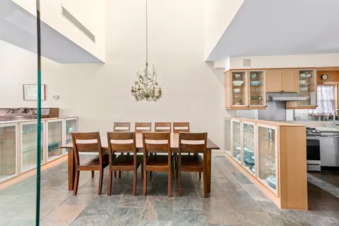 a view of a living room and dining room