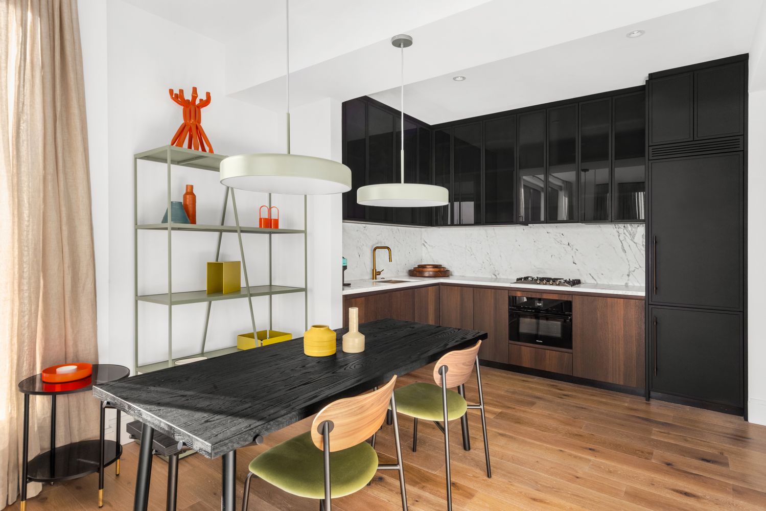 a kitchen with a table and chairs in it