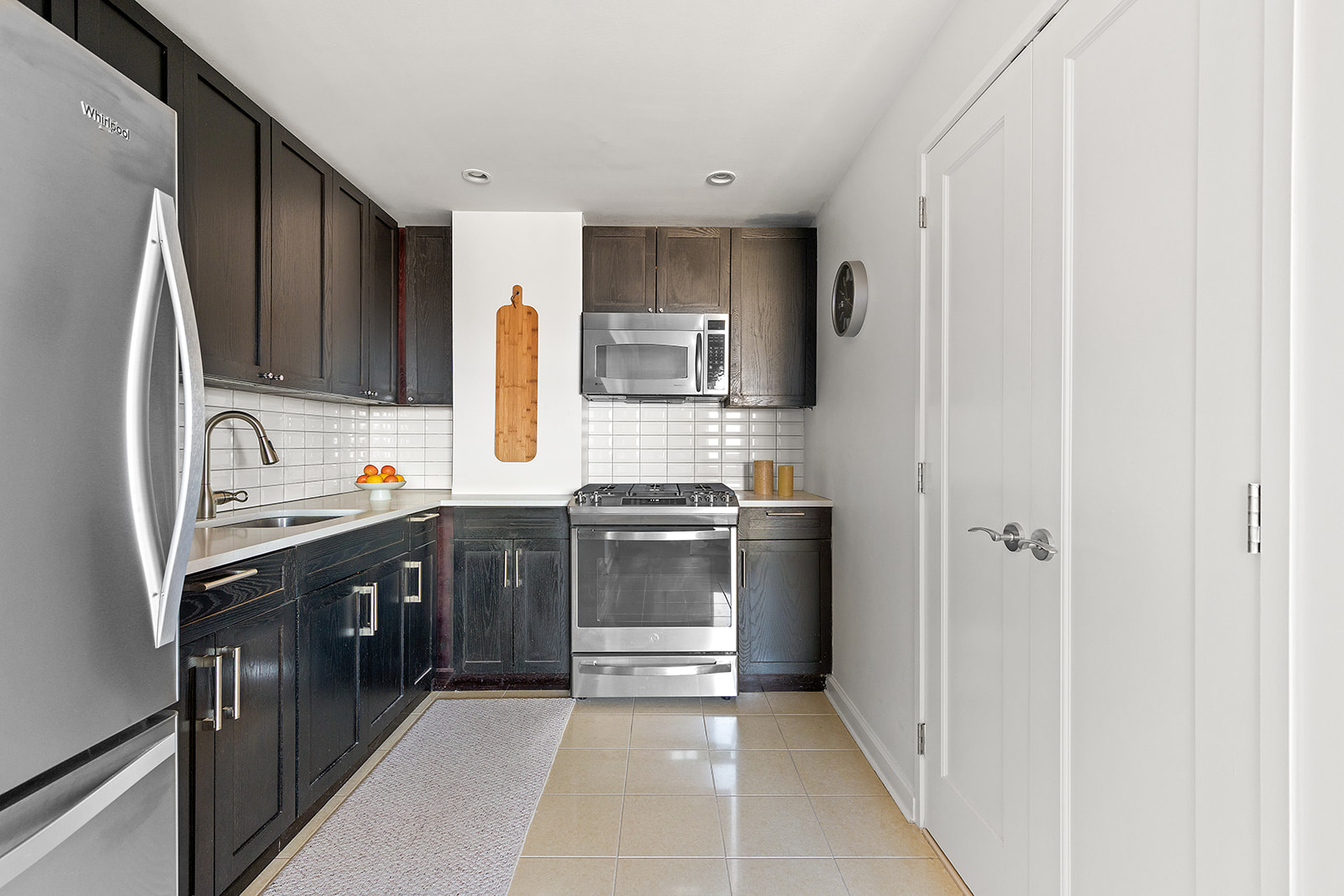 145 Park Place, Unit 6B Brooklyn, NY 11217 - Photo 4 of 17 a kitchen with stainless steel appliances granite countertop a refrigerator and a stove top oven
