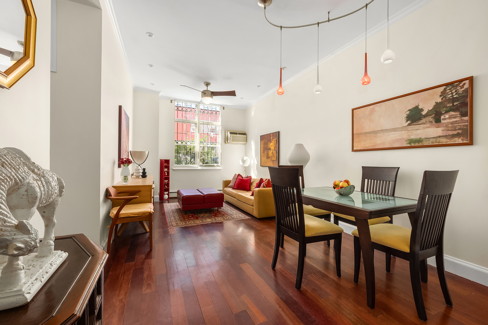 163 St Nicholas Avenue, Unit 1I Manhattan, NY 10026 - Photo 1 of 12 a living room with furniture and wooden floor