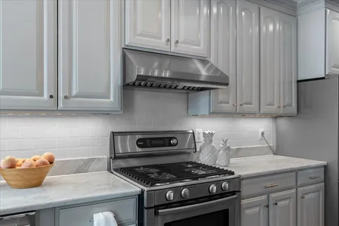 a kitchen with refrigerator and window