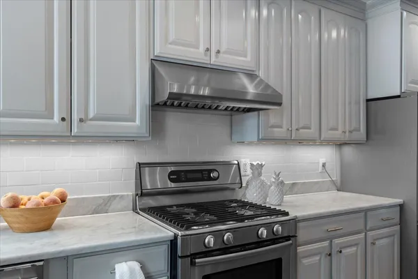 a kitchen with refrigerator and window