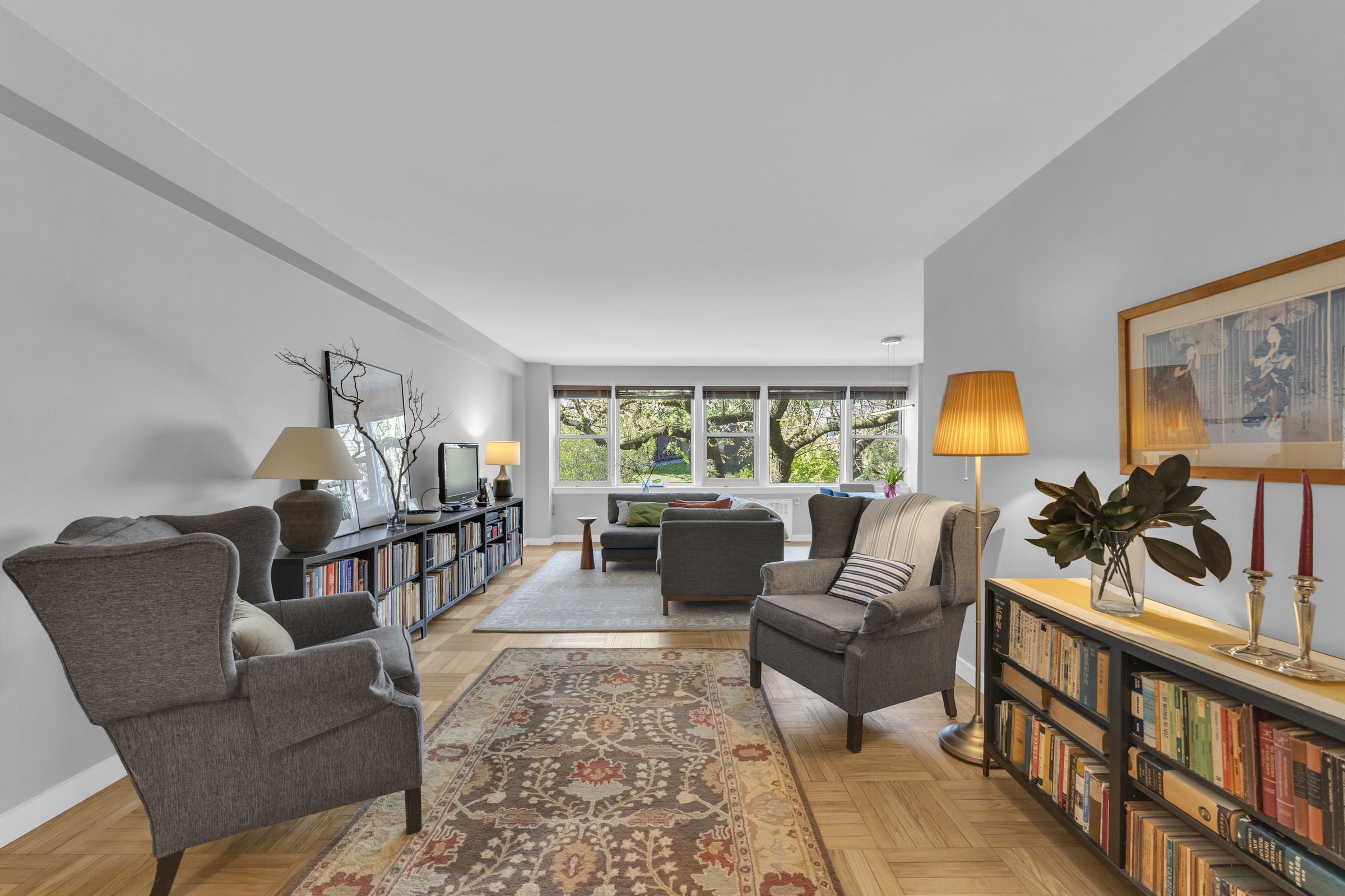4555 Henry Hudson Parkway West, Unit A310 Bronx, NY 10471 - Photo 3 of 16 a living room with furniture and a wooden floor