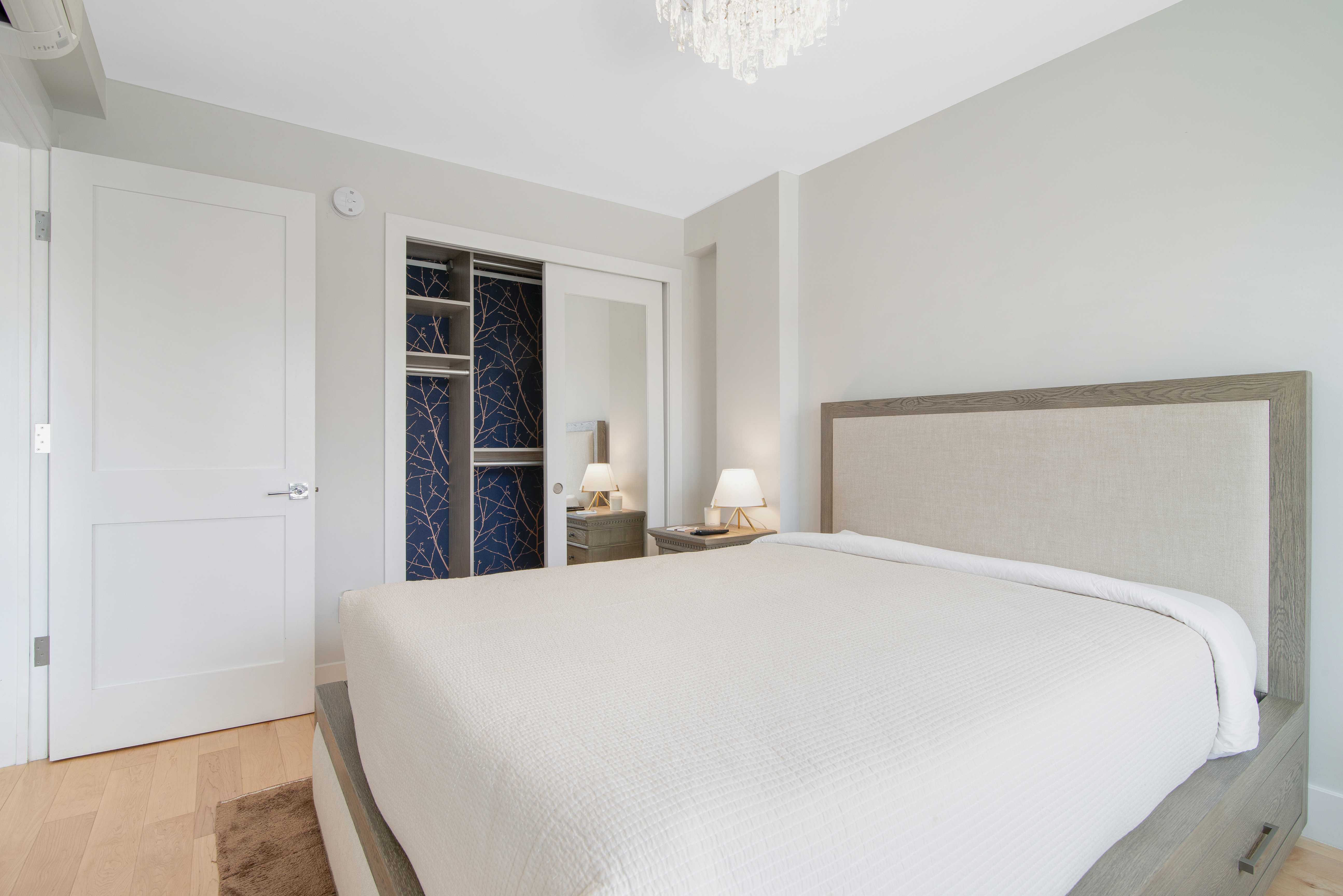 23-05 24th Avenue, Unit 3B Queens, NY 11102 - Photo 6 of 10 a large bed sitting in a bedroom and closet