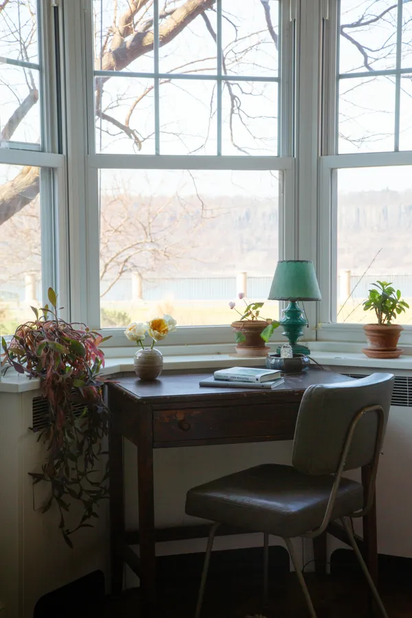 a table with chairs and window
