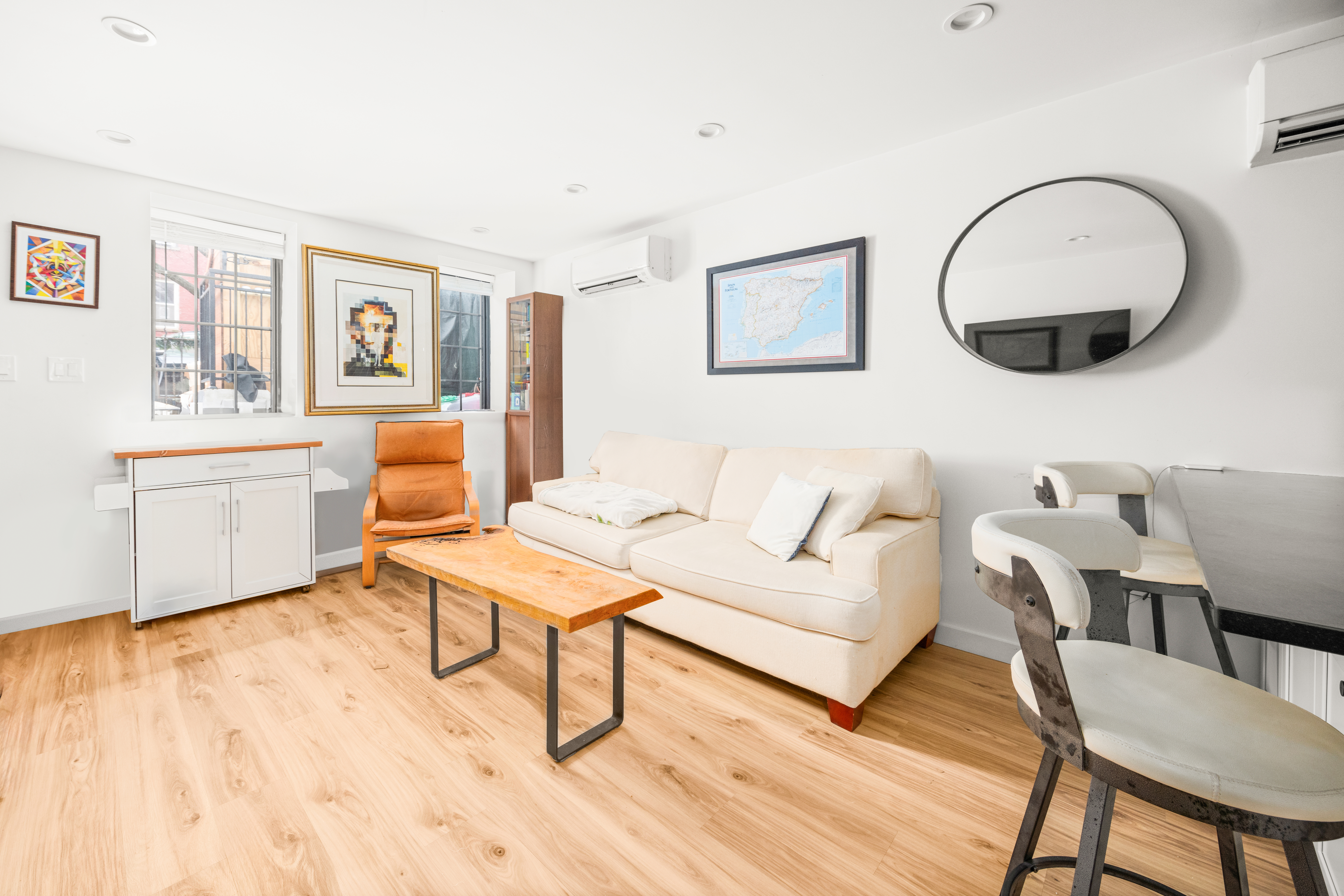 211 14th Street Brooklyn, NY 11215 - Photo 14 of 18 a living room with furniture and a large window