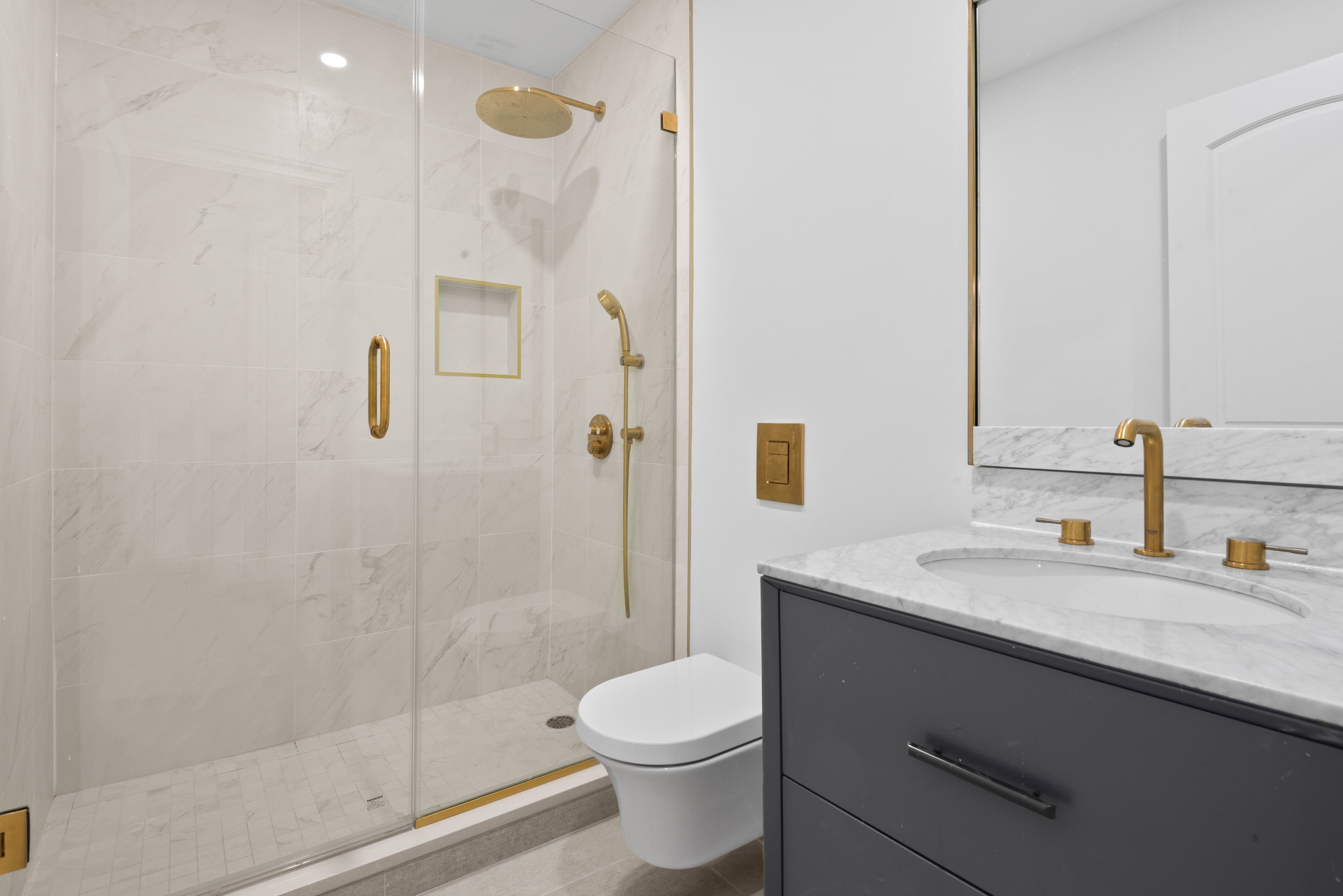 30 Weirfield Street Brooklyn, NY 11221 - Photo 27 of 29 a bathroom with a granite countertop sink toilet and shower