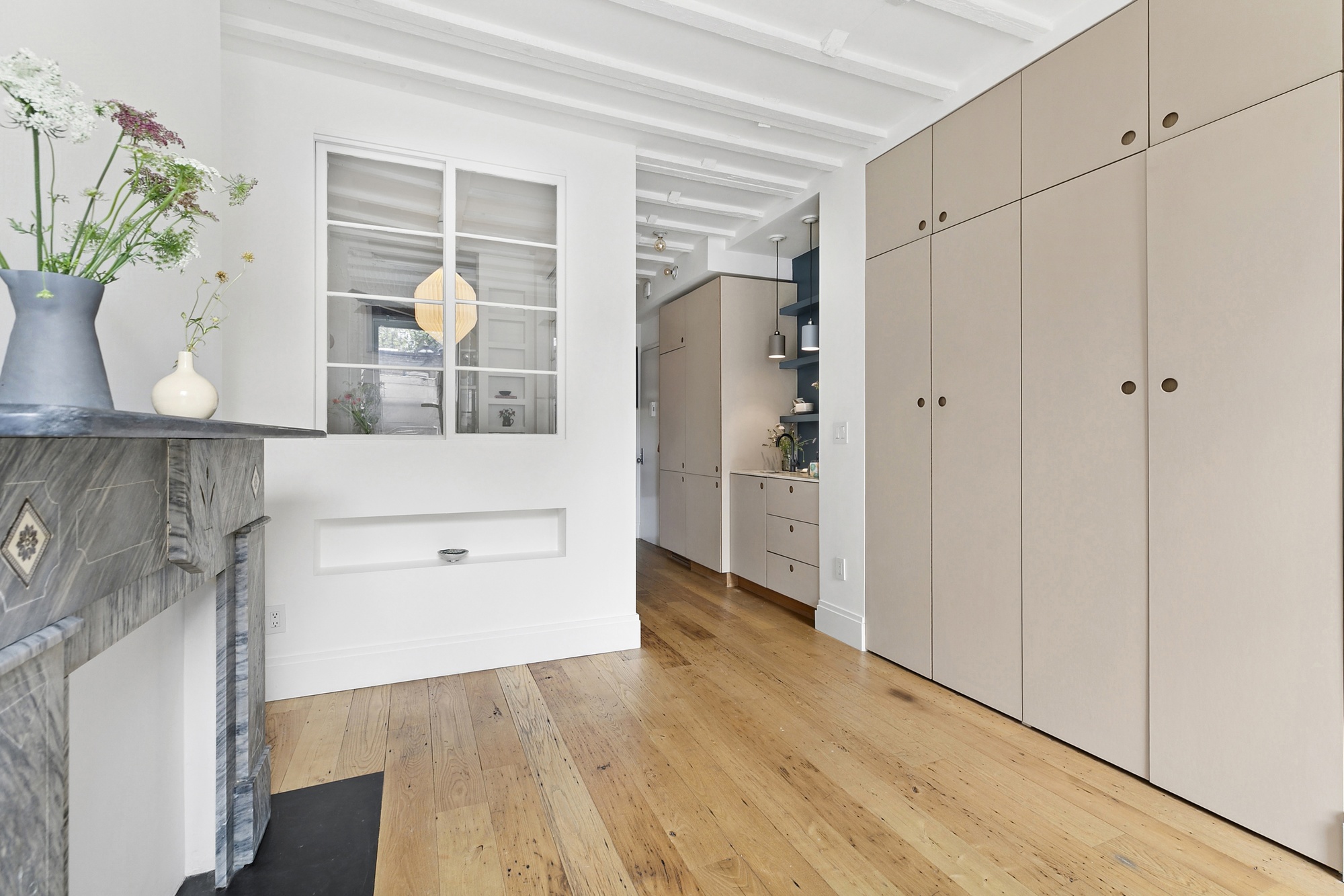 138 West 10th Street, Unit 2RW Manhattan, NY 10014 - Photo 2 of 10 a view of storage and utility room with wooden floor